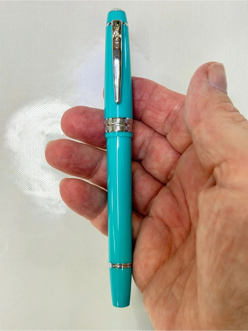 Cross Bailey Light Fountain pen in turquoise with silver accents.